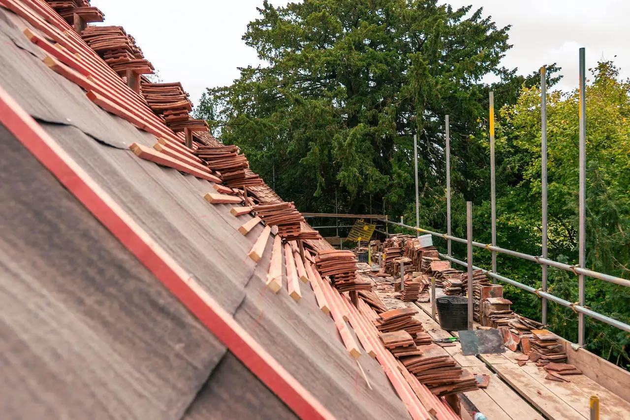 A close-up of natural slate laid on a residential pitched roof.