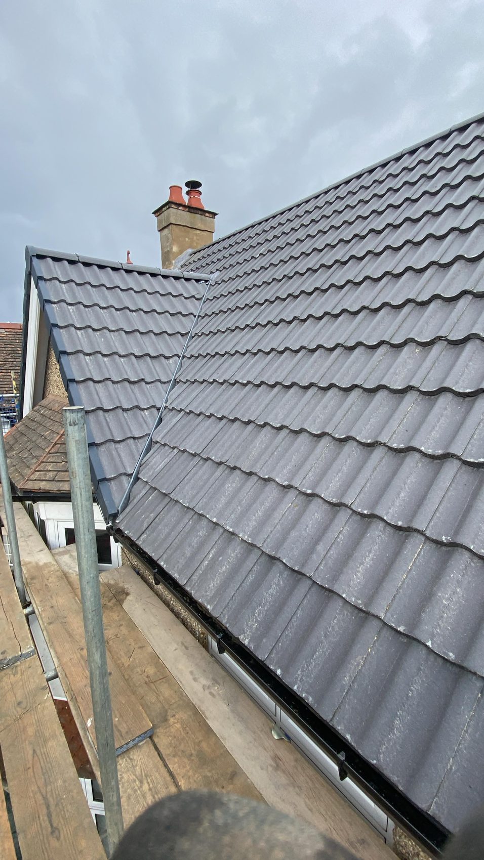06 · The finished roof, re-covered in new tiles