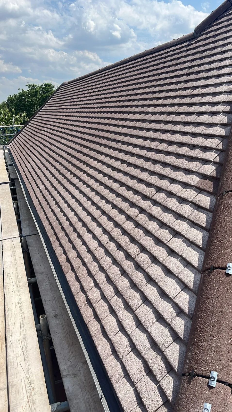 01 · Fresh tiles up the hipped slope