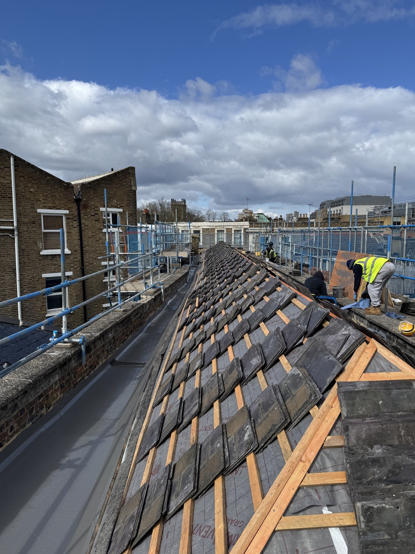 Reclaimed slate roof with new lead box gutter, London