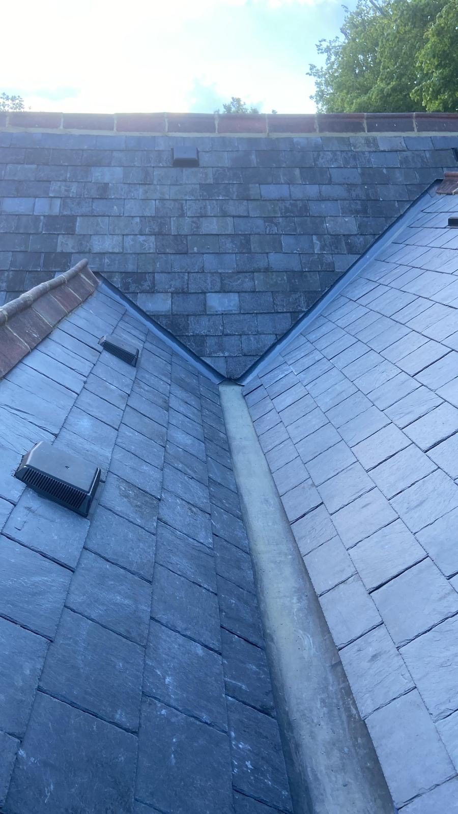 Lead valley between two slate slopes with roof vents