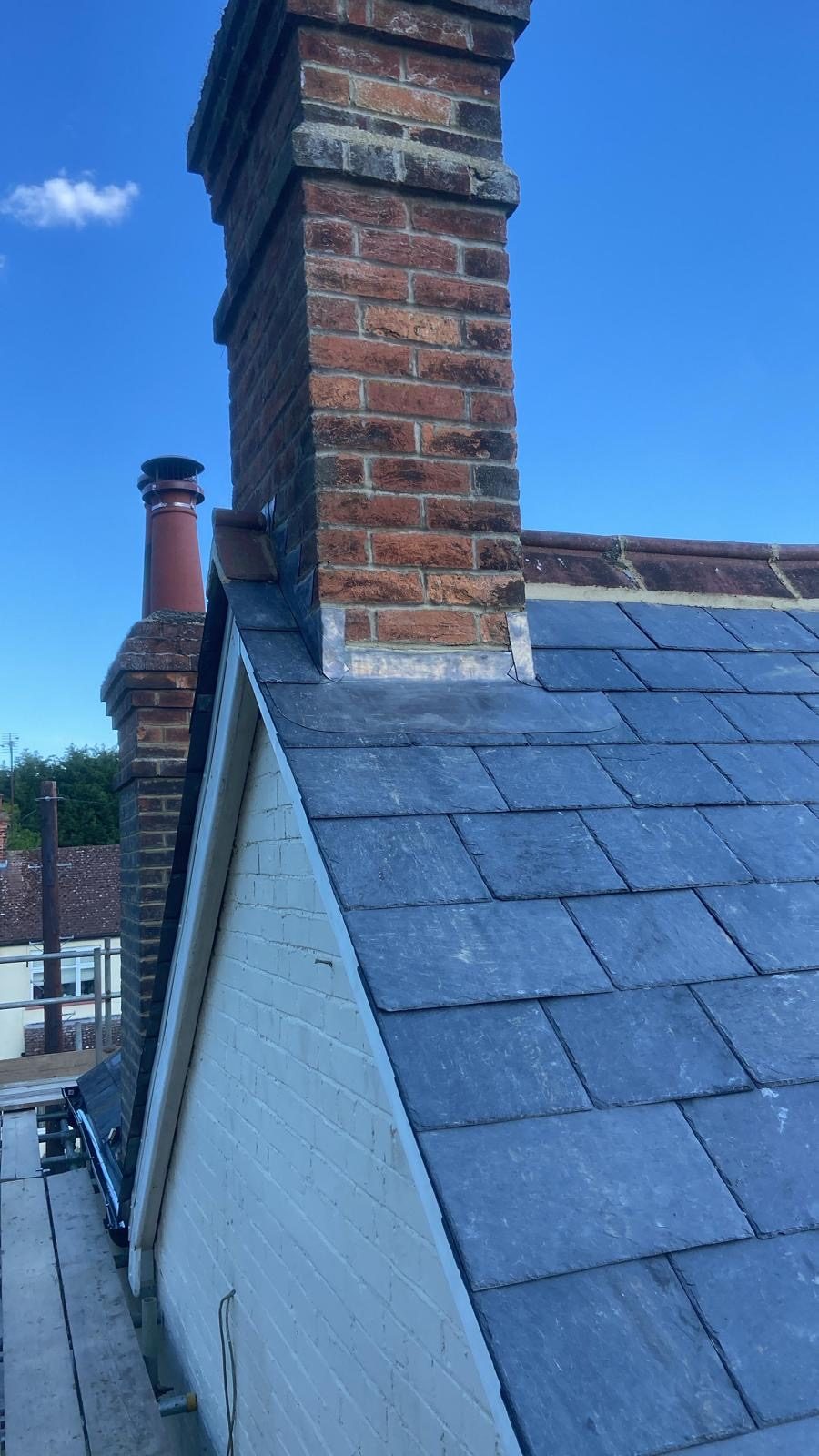 Slate meeting a brick chimney with new lead flashing