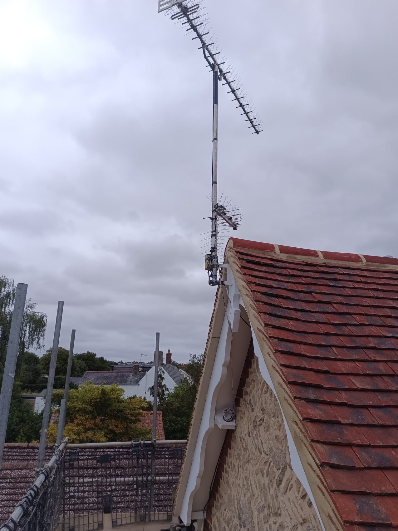 Finished plain clay tile roof and new decorative gable on the Sherington cottage