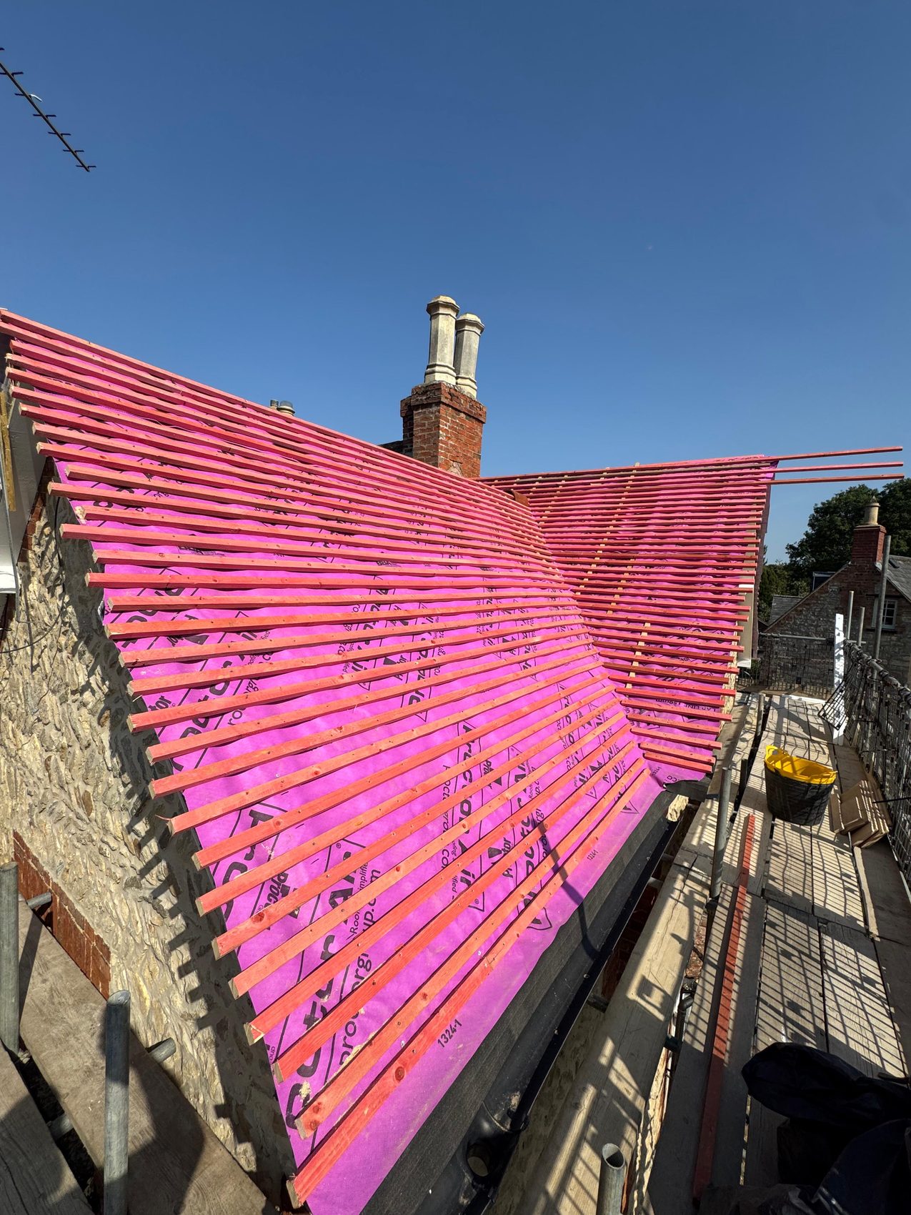 Sherington roof stripped back to breathable membrane and battens before re-tiling